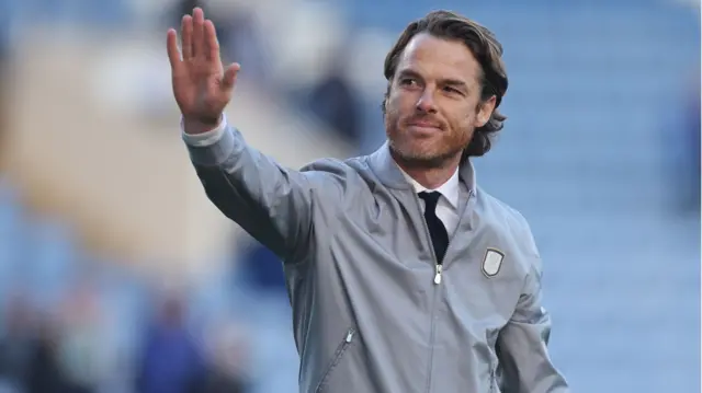 Burnley manager Scott Parker waves to supporters