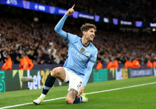 John Stones of Manchester City celebrates scoring his team's third goal