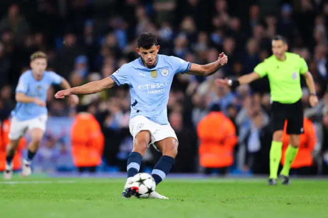 Matheus Nunes of Manchester City scores his side's fifth goal from the penalty spot