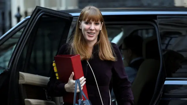 A file photo of Angela Rayner, leaving a car holding a red folder