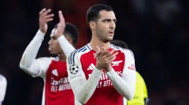 Mikel Merino applauds the Arsenal fans