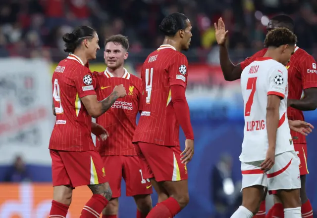 Darwin Nunez celebrates with teammates scoring his team's first goal