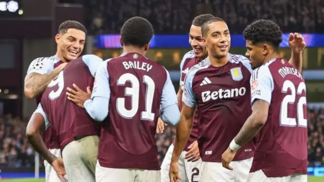 Aston Villa players celebrate after scoring against Bologna