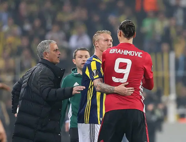 Simon Kjaer (R 2) of Fenerbahce argues with Zlatan Ibrahimovic