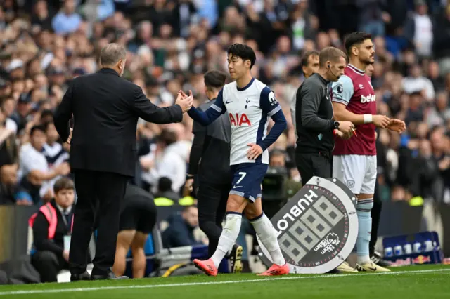Son Heung-min shakes hands with Ange Postecoglou after being substituted in Saturday's 4-1 win over West Ham