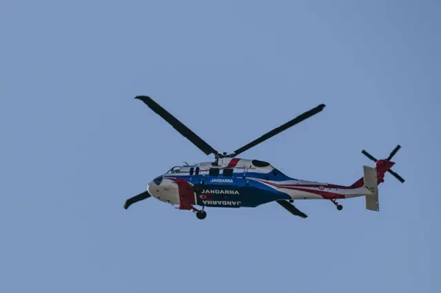 A police helicopter is flying