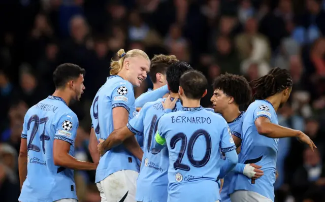 : Erling Haaland of Manchester City celebrates with teammates after scoring his team's second goal