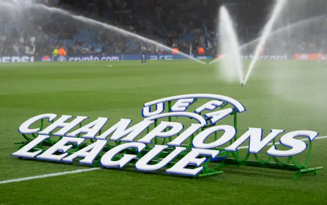 The Champions League logo sits on stands above the Etihad pitch