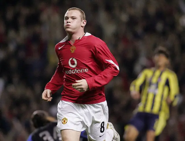 Rooney wheels away in celebration