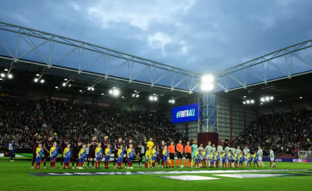 EDINBURGH , SCOTLAND - OCTOBER 24: The teams come out during a UEFA Conference League 2024/25 League Phase MD2 between Hearts and Omonia Nicosia at Tynecastle Park, on October 24, 2024, in Edinburgh, Scotland.  (Photo by Craig Foy / SNS Group)