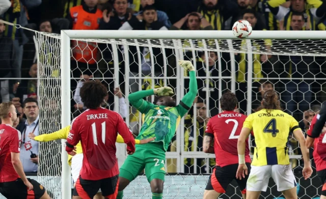 Manchester United's Andre Onana makes a save