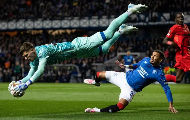 GLASGOW, SCOTLAND - OCTOBER 24: Rangers' James Tavernier (R) fouls FCSB goalkeeper Stefan Tornovanu during a UEFA Europa League 2024/25 League Phase MD3 match between Rangers and FCSB at Ibrox Stadium, on October 24, 2024, in Glasgow, Scotland. (Photo by Alan Harvey / SNS Group)