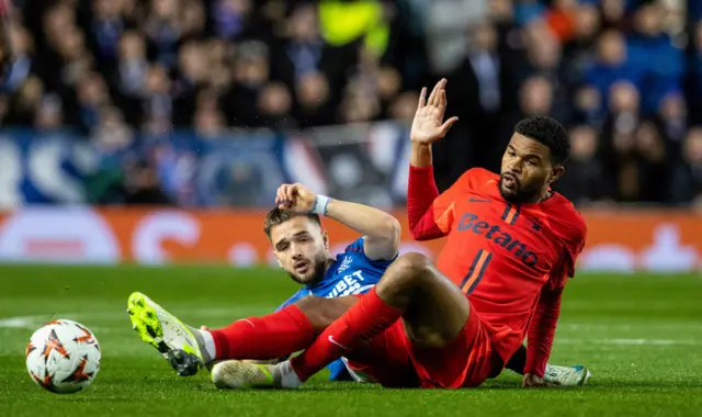 GLASGOW, SCOTLAND - OCTOBER 24: FCSB's Malcom Edjouma (R) and Rangers' Nicolas Raskin in action during a UEFA Europa League 2024/25 League Phase MD3 match between Rangers and FCSB at Ibrox Stadium, on October 24, 2024, in Glasgow, Scotland. (Photo by Alan Harvey / SNS Group)