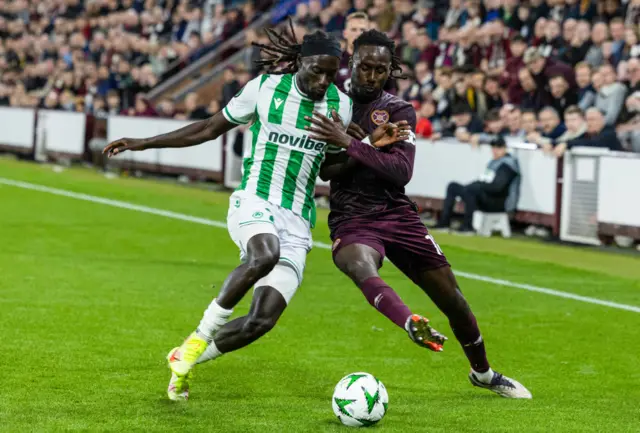 EDINBURGH , SCOTLAND - OCTOBER 24: Hearts' Malachi Boateng (R) and Omonia's Alpha Dionkou (L) in action during a UEFA Conference League 2024/25 League Phase MD2 between Hearts and Omonia Nicosia at Tynecastle Park, on October 24, 2024, in Edinburgh, Scotland.  (Photo by Ross Parker / SNS Group)