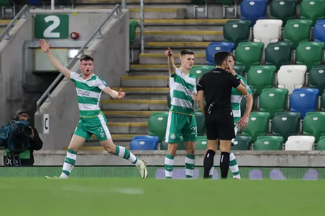 Shamrock players claim a goal