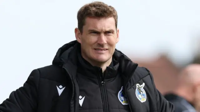 Matt Taylor on the sidelines watching his Bristol Rovers side