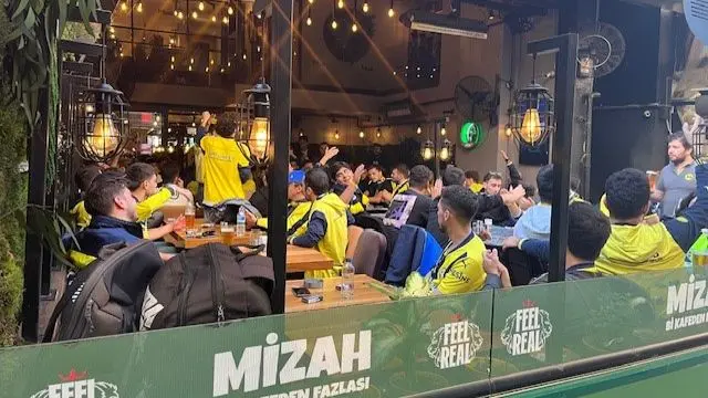 Fenerbahce fans sat in a cafe in Istanbul