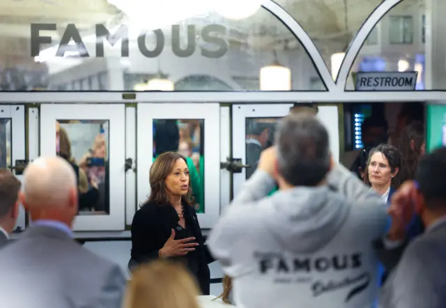 Kamala Harris speaks to people in Pennsylvania and gestures with her hand