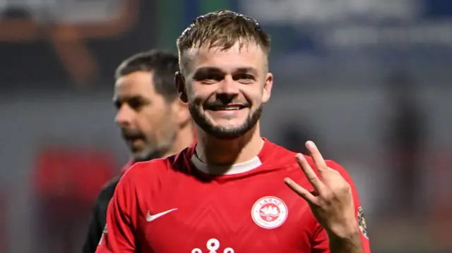 Andy Ryan celebrates his treble for Larne against Lincoln Red Imps in August