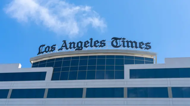 Los Angeles Times Headquarters. The newspaper's logo was mounted on top of a white building with tall rectangular windows