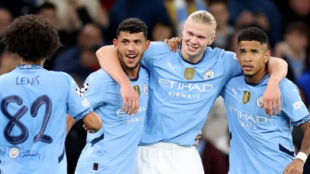 Erling Haaland celebrates with his team-mates after scoring his second goal for Manchester City against Sparta Prague