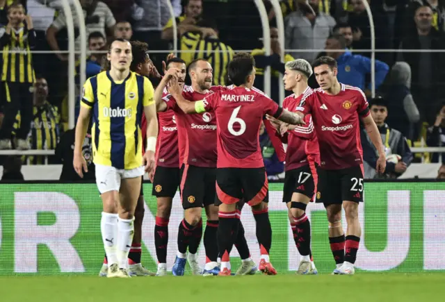 Players of Manchester United celebrate after scoring