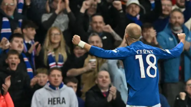 Vaclav Cerny celebrates in front of fans after scoring