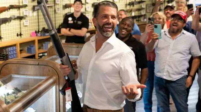 Trump jr with a gun