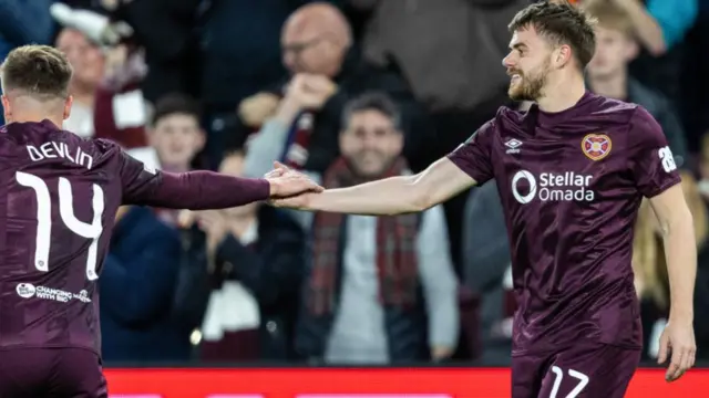 EDINBURGH , SCOTLAND - OCTOBER 24: Alan Forrest (R) celebrates with Cammy Devlin (L) as he scores to make it 1-0 during a UEFA Conference League 2024/25 League Phase MD2 between Hearts and Omonia Nicosia at Tynecastle Park, on October 24, 2024, in Edinburgh, Scotland.  (Photo by Ross Parker / SNS Group)