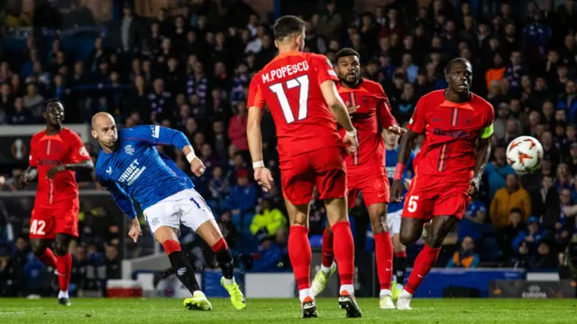 GLASGOW, SCOTLAND - OCTOBER 24: Rangers' James Tavernier (R) fouls FCSB goalkeeper Stefan Tornovanu during a UEFA Europa League 2024/25 League Phase MD3 match between Rangers and FCSB at Ibrox Stadium, on October 24, 2024, in Glasgow, Scotland. (Photo by Alan Harvey / SNS Group)