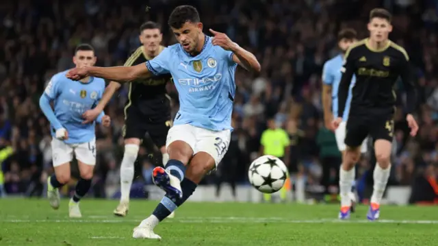 Matheus Nunes scores a penalty in Manchester City's 5-0 win against Sparta Prague.