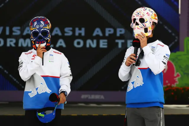 Yuki Tsunoda and Liam Lawson wear day of the dead masks