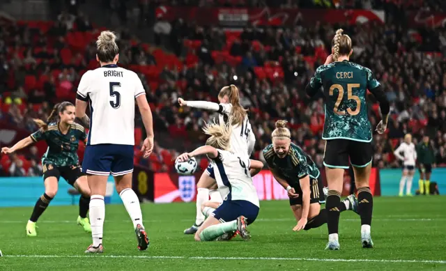 England's Alessia Russo concedes a penalty against Germany's Pia-Sophie Wolter