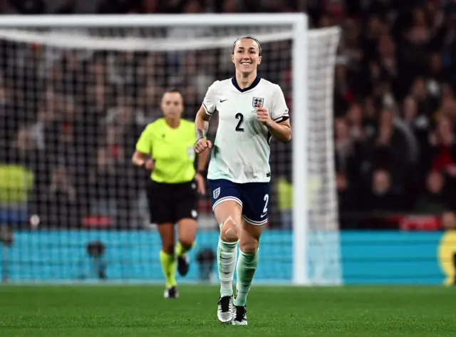 Lucy Bronze smiling after scoring