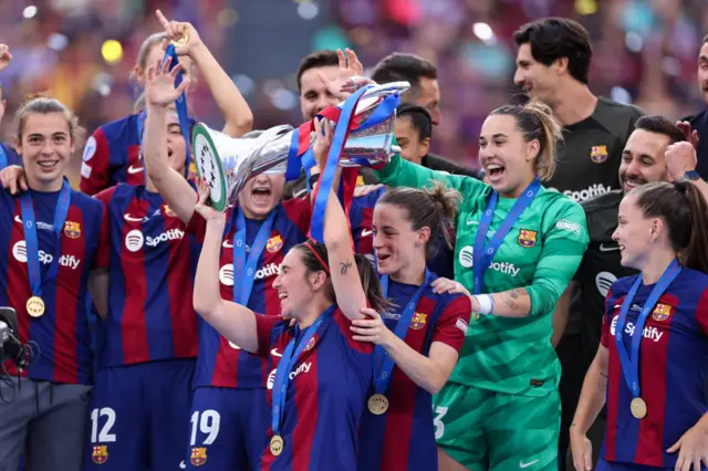 Barcelona celebrate winning the Champions League last season