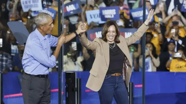 Obama and Harris hold hands