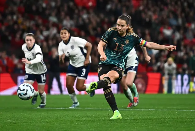 Germany's Sara Dabritz scores their fourth goal from the penalty spot