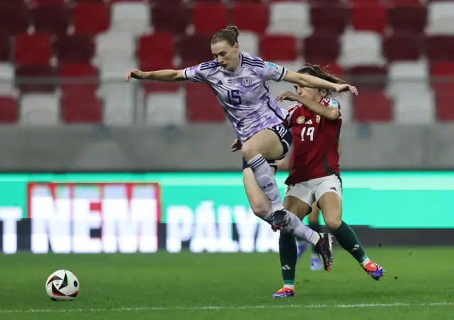 Jenna Clark of Scotland is challenged by Yulya Carella of Hungary