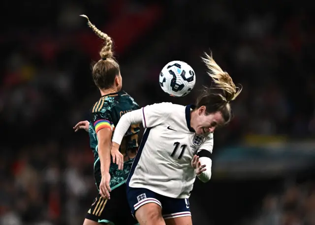 England's Lauren Hemp in action with Germany's Giulia Gwinn