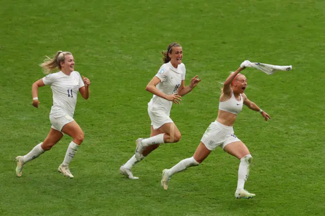 Chloe Kelly of England celebrates after scoring their team's second goal with team mates Jill Scott and Lauren Hemp during the UEFA Women's Euro 2022 final match between England and Germany