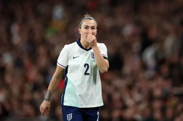 Lucy Bronze touching her nose