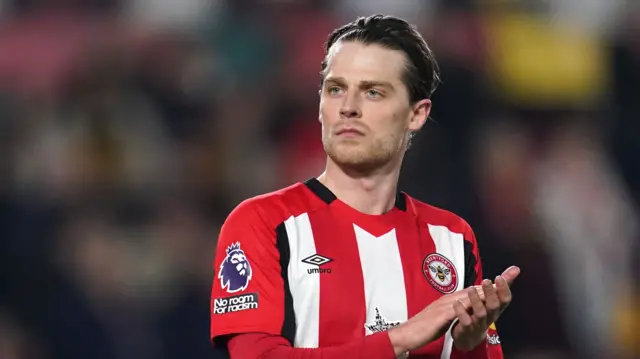 Mathias Jensen applauds while playing for Brentford