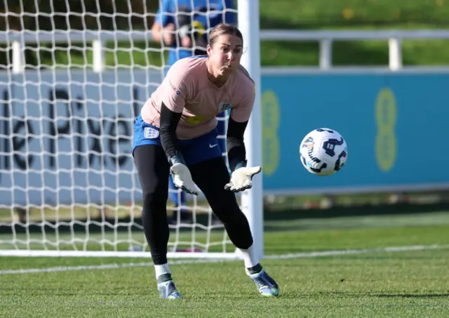 Mary Earps catches a ball in training