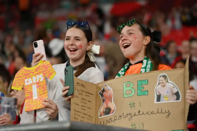 Fans with signs for Mary Earps