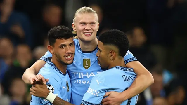 Erling Haaland celebrates a Manchester City goal with Matheus Nunes and Savinho