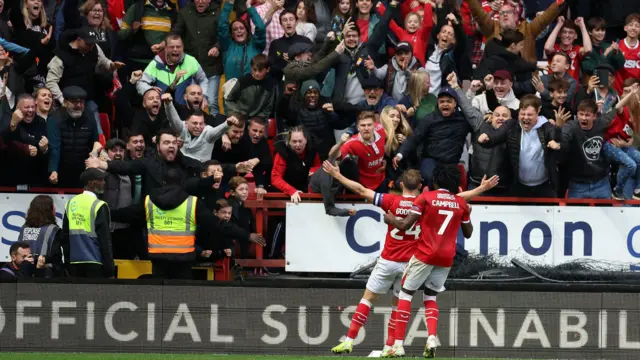 Matty Godden celebrates in front of the Charlton fans.