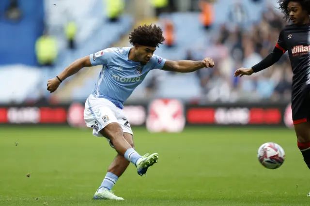 Coventry City's Milan van Ewijk (left) attempts a shot on goal