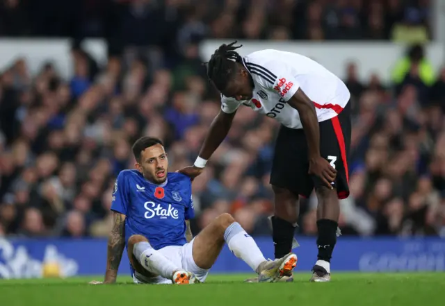 Bassey comforts McNeil who is on the floor in discomfort