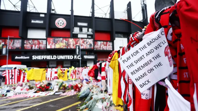 Tributes outside the stadium in memory of George Baldock