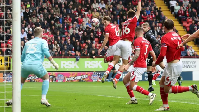 The ball clips Conor Coventry on its way to the Charlton goal.